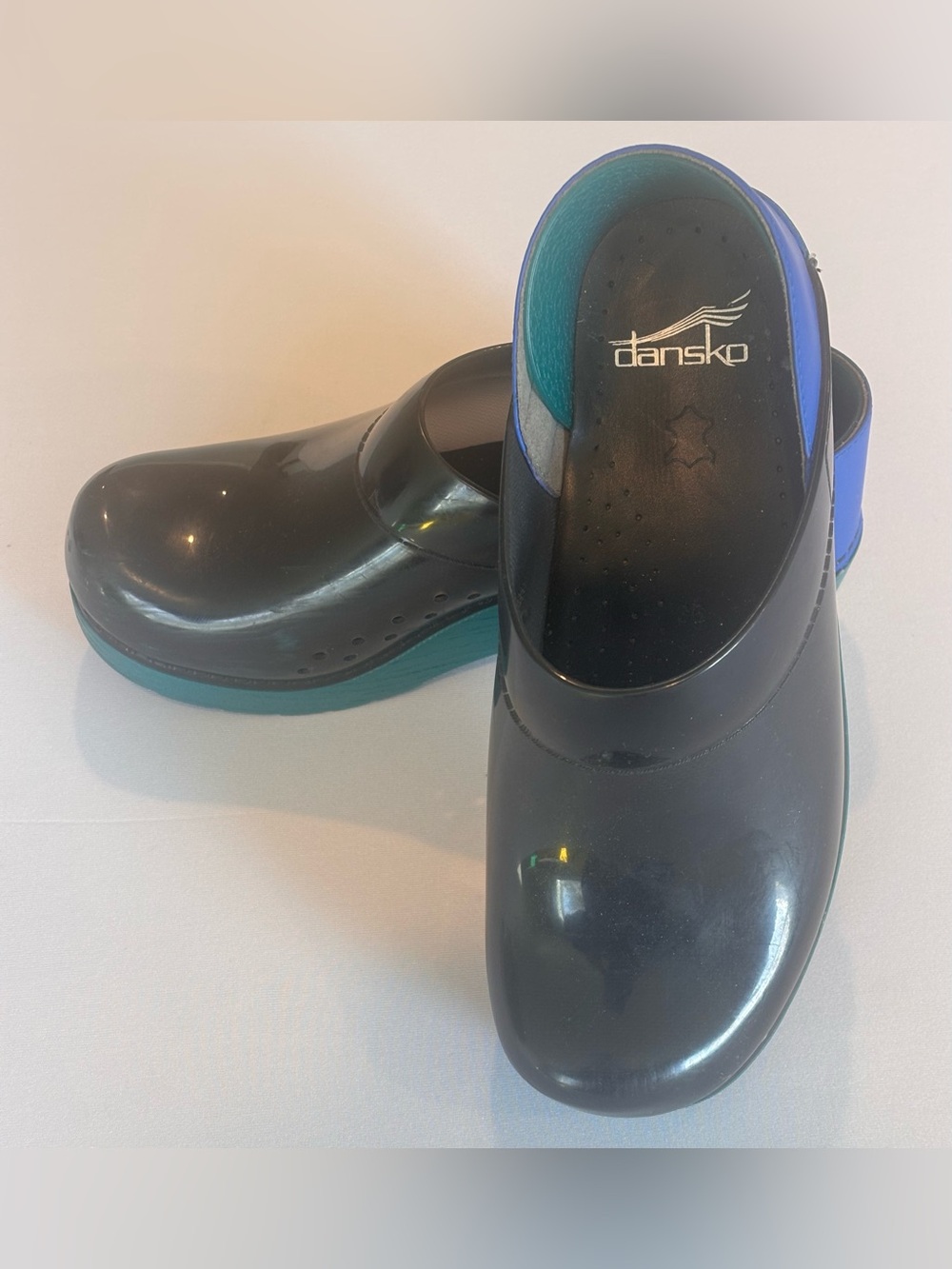Dansko Black Slip-On Clogs with Teal and Blue Accents